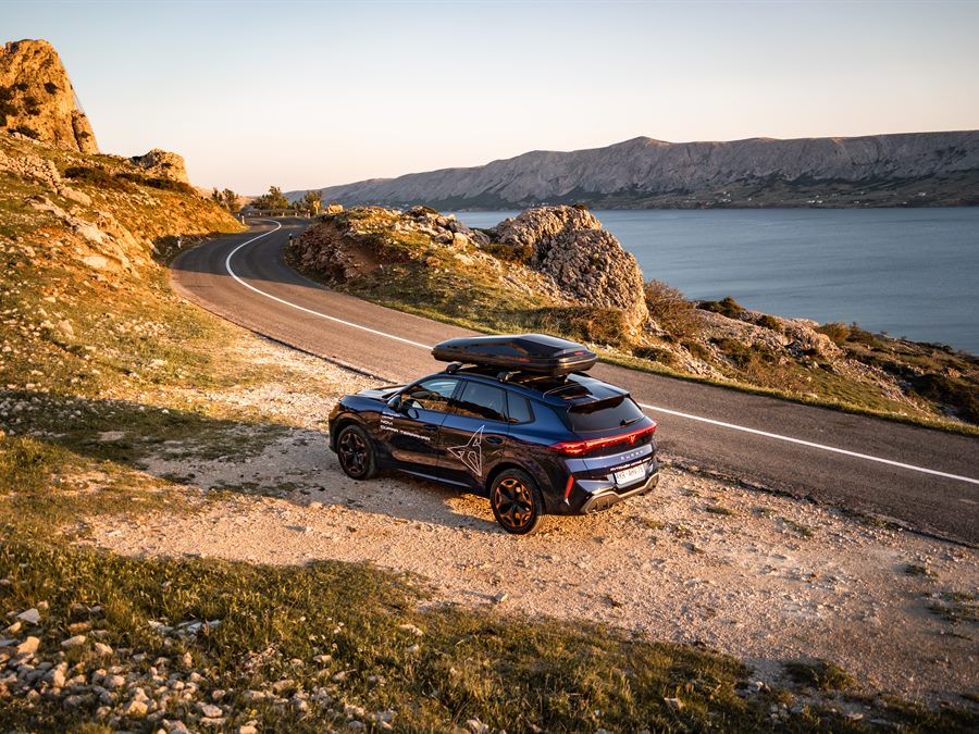Car on a coastal road above the sea
